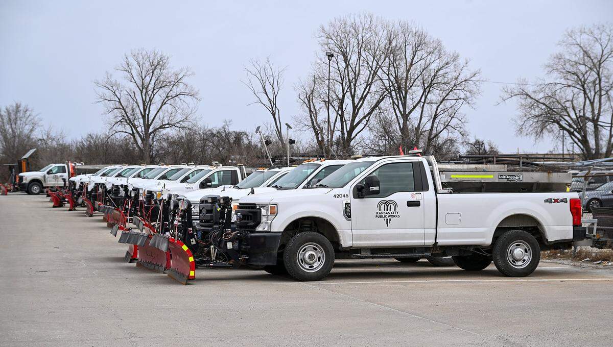 Snow plows from Kansas City Public Works sit lined up in a KC lot on Friday, Jan. 23, 2025, as the city prepares for the impending winter storm, which the National Weather Service said could dump up to 8 to 9 inches of snow on the metro this weekend.