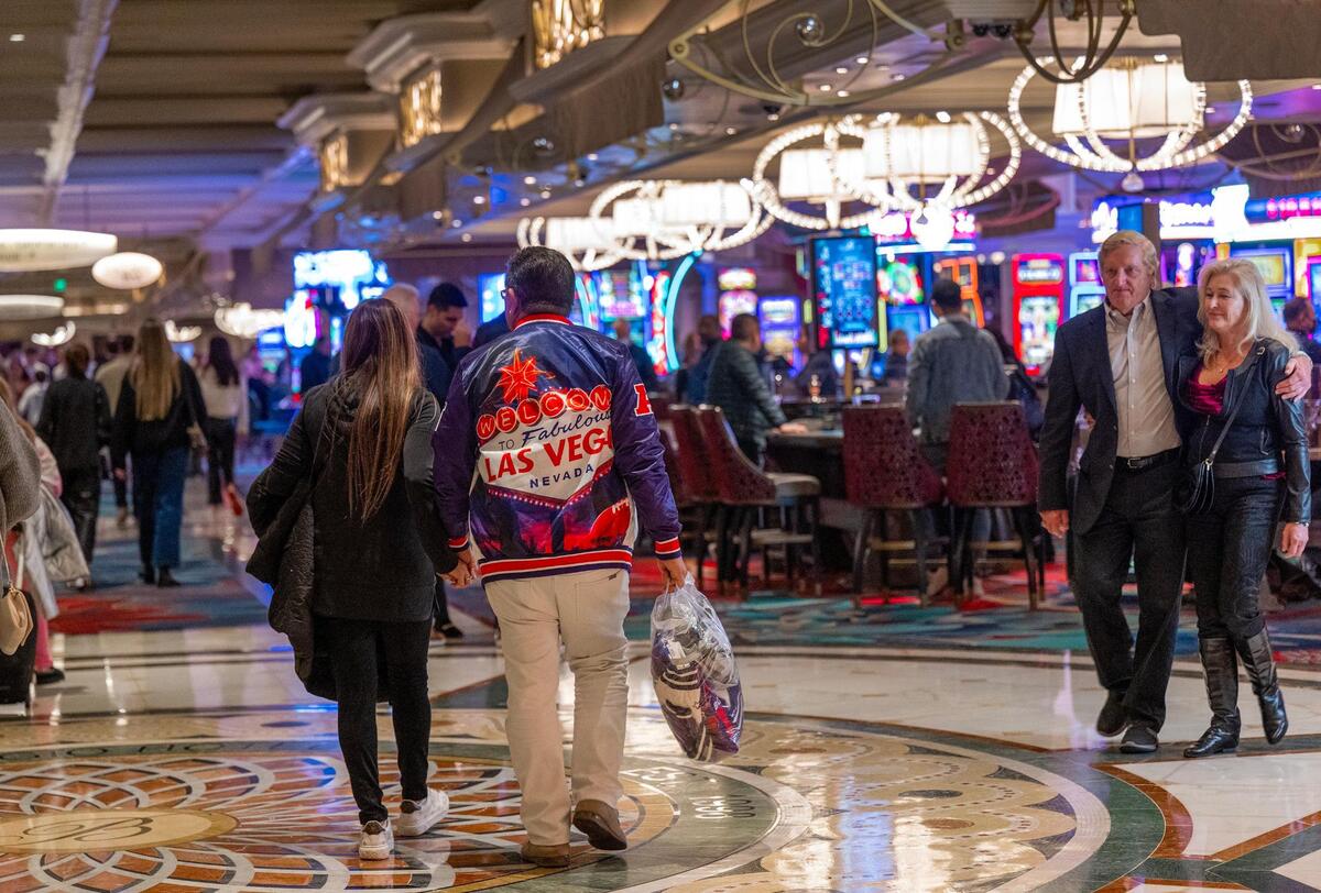 Football fans walk through the Bellagio Las Vegas on Thursday, Feb. 8, 2024, in Las Vegas, Nevada.