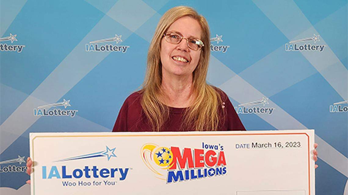 Marla Ballard with her oversized check.