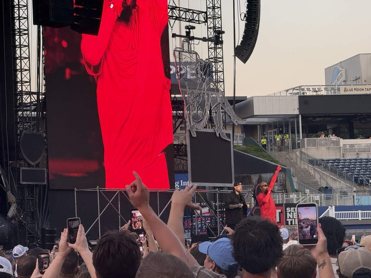 Tech N9ne made a surprise appearance on Wednesday night at Kauffman Stadium for Post Malone’s Kansas City leg of The Big Ass Stadium Tour Part 2 on July 16, 2026. The KC-based rapper came to perform “Red Kingdom,” and departed the stage as quickly as he came.