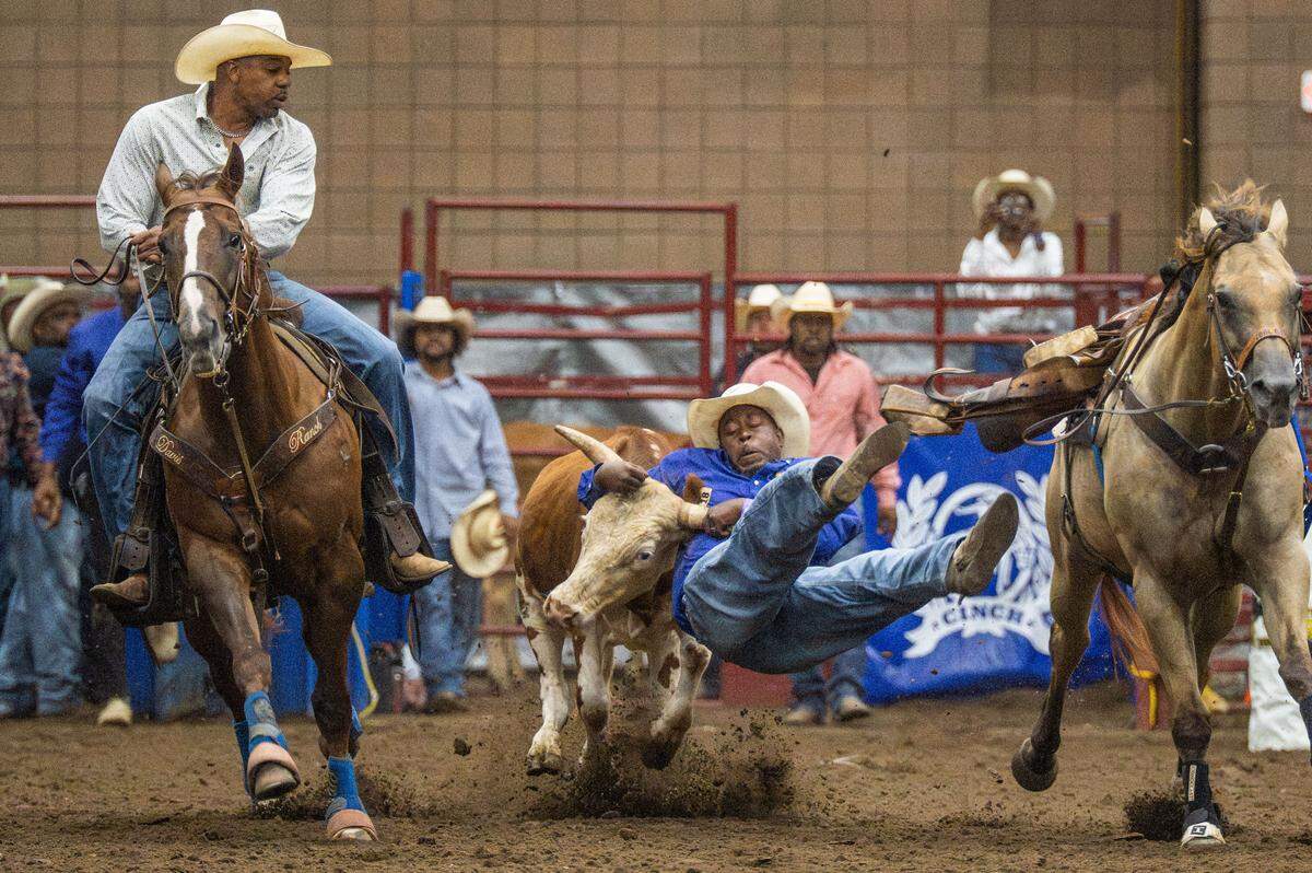 Devin Sebile wrestles down a young steer during the Black Rodeo USA show, inside the American Royal in Kansas City on Saturday, July 26, 2025. The rodeo held two sold-out shows in its return to town for the first time in years.