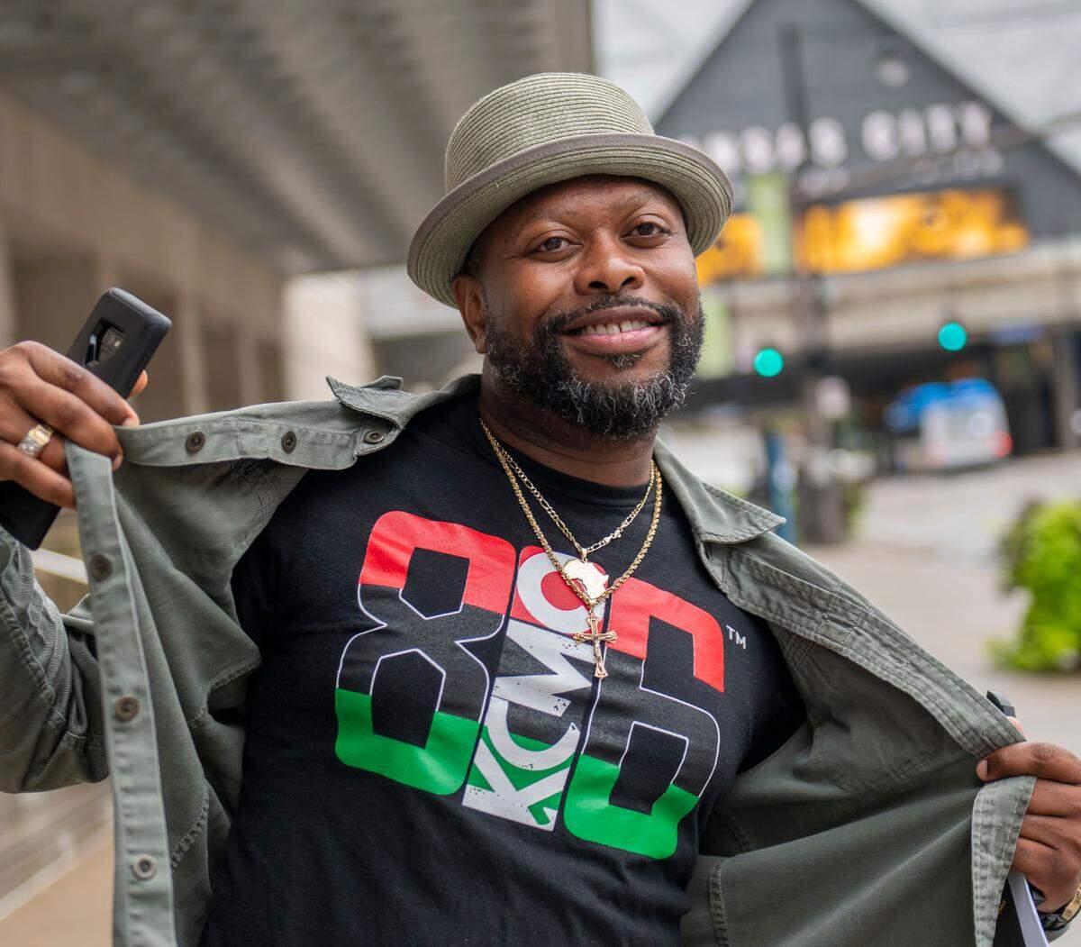 Brian “Bizzy” Benton shows off his T-shirt for 816 Day, an annual event he launched in 2017 that has continued to grow.