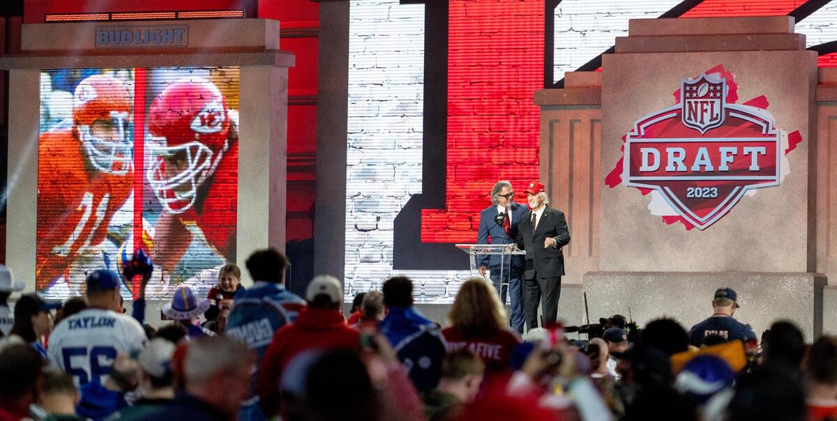 Brad and Ed Budde, former Chiefs players, announce the 55th overall pick by the Kansas City Chiefs during the second round of the NFL Draft outside of Union Station on Friday, April 28, 2023, in Kansas City.