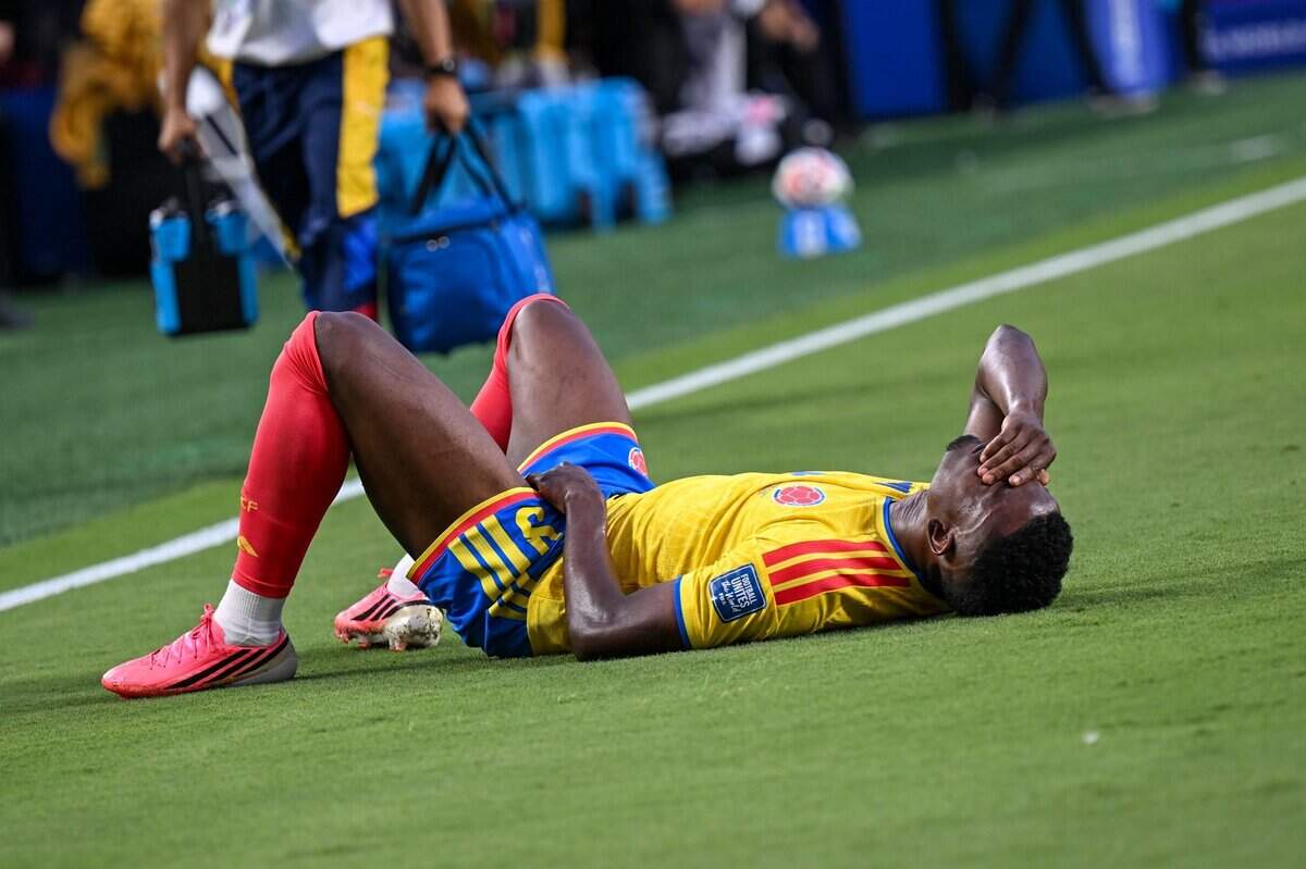 Colombia forward Jhon Córdoba (9) lays on the field waiting for medical attention during the first half of the Colombia vs. Ghana 2026 World Cup round of 32 football match at Kansas City (Arrowhead) Stadium in Kansas City on Friday, July 3, 2026.