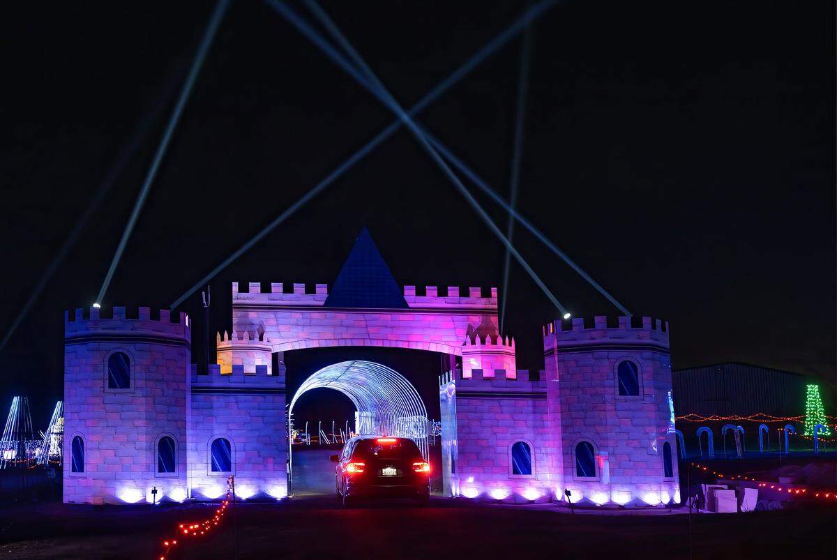 A car drives through the castle at North Pole Acres, 1010 NW 1st St., in Oak Grove on Wednesday, Dec. 10.