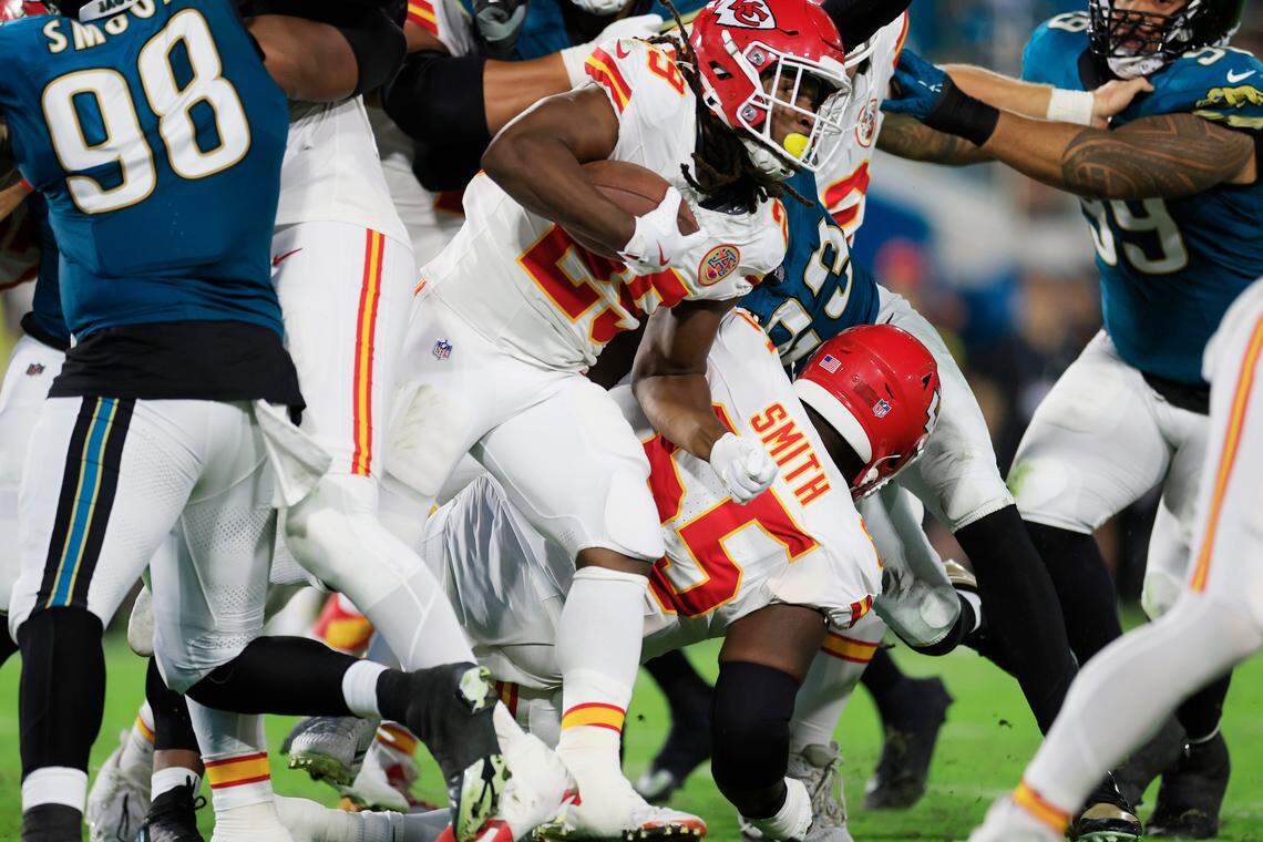 Kansas City Chiefs running back Kareem Hunt, top-center of picture, rushes for some extra yardage during an NFL game against the Jaguars at EverBank Stadium in Jacksonville, Florida, on Monday, Oct. 6, 2025.