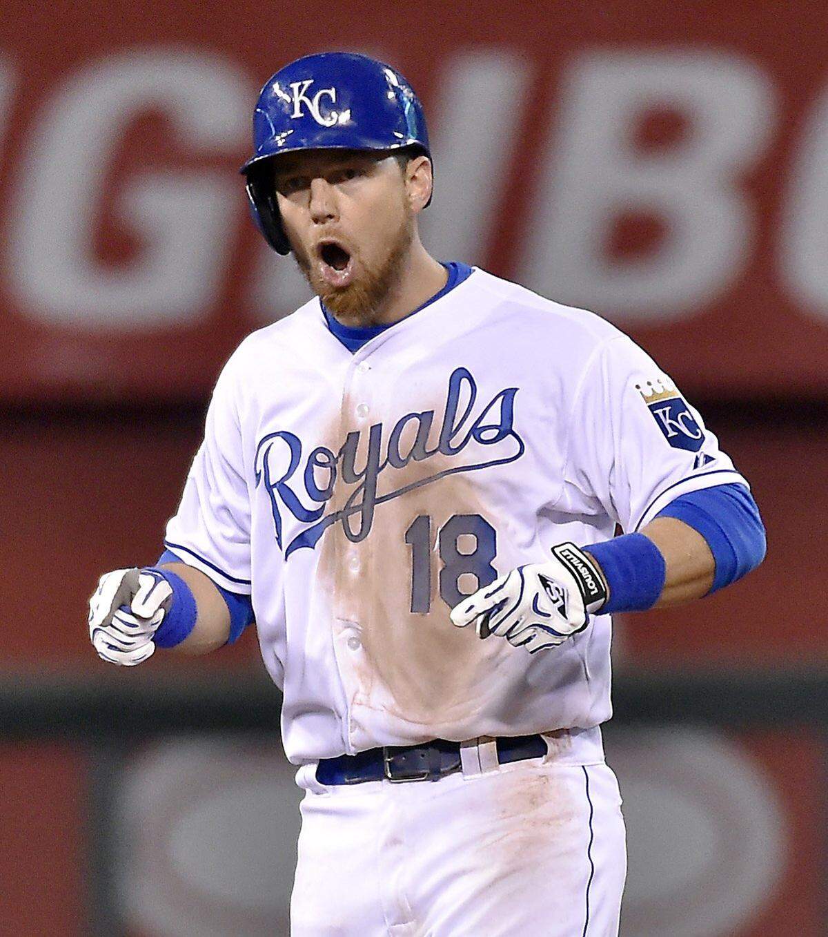 Kansas City Royals second baseman Ben Zobrist celebrates on second base after hitting a double in the eighth inning during Game 1 of the World Series on Tuesday, October 27, 2015 at Kauffman Stadium in Kansas City, Mo.