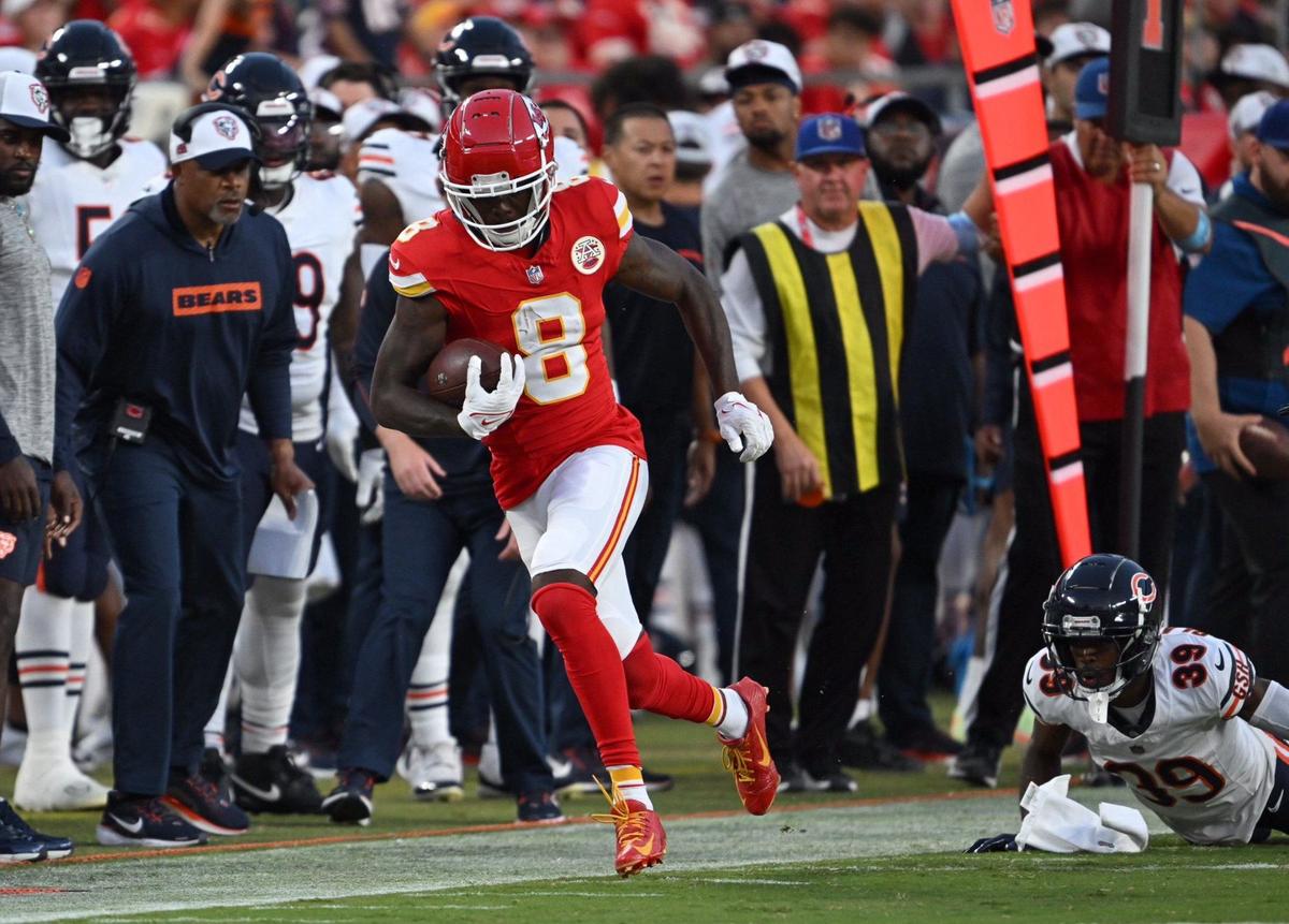 Kansas City Chiefs wide receiver Justyn Ross (8) leaves Chicago Bears cornerback Josh Blackwell (39) in the dust as he runs for a first down in the first quarter Thursday. (082224, Arrowhead Stadium)
