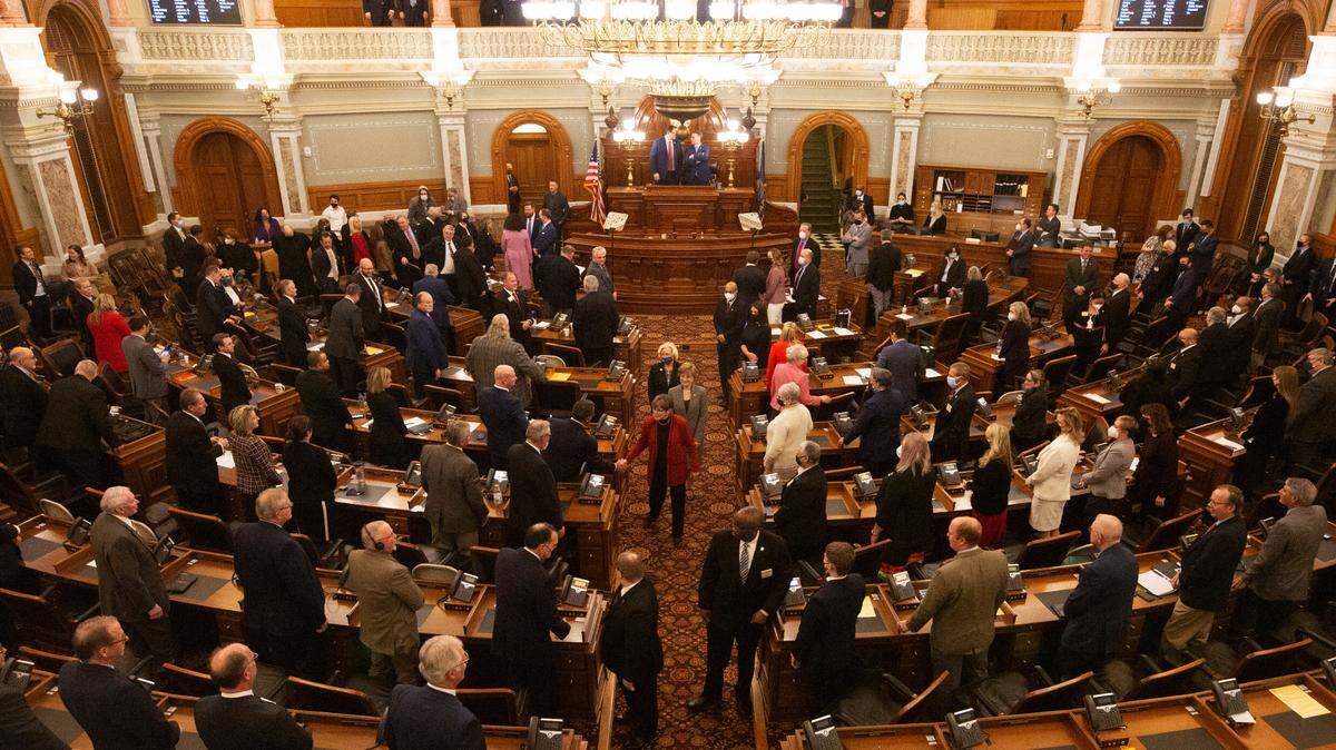Legislative members shake hands with Gov. Laura Kelly as she exits the house chambers following her State of the State address, Tuesday, Jan. 11, in Topeka.