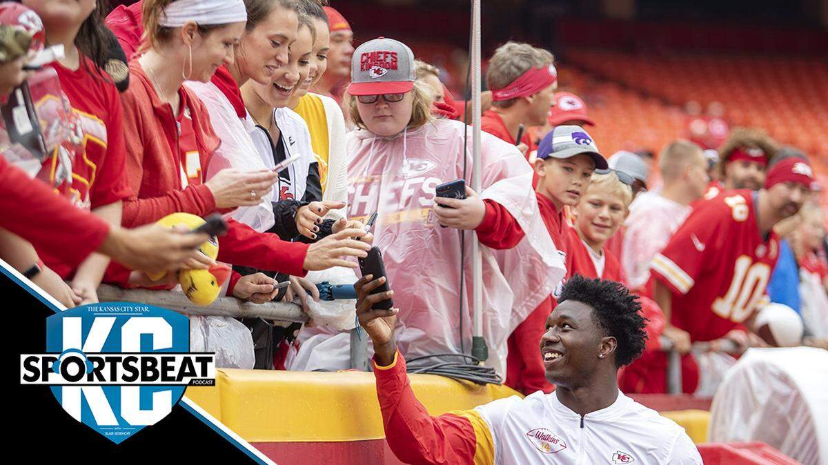 Chiefs wide receiver Sammy Watkins hands Claudia Hoffmeister’s phone back after taking a photo before the game against the Baltimore Ravens.