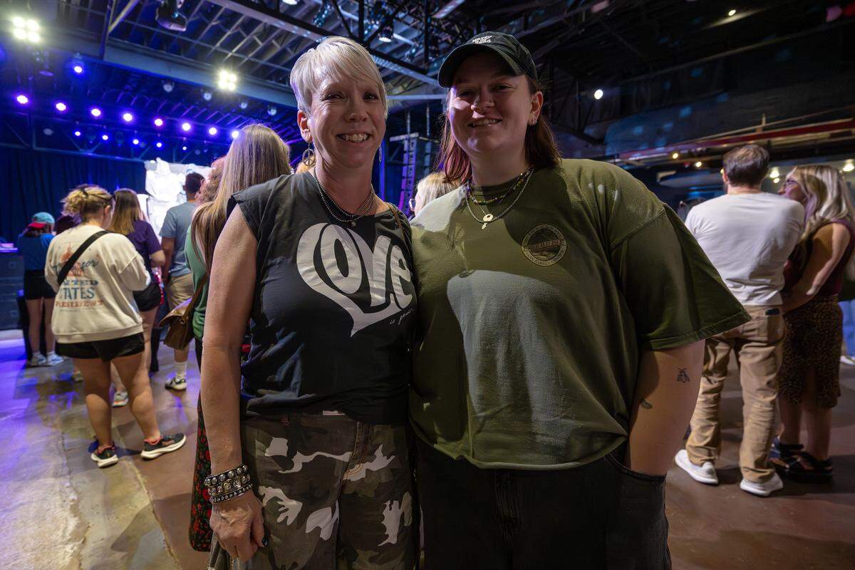 Jennifer Boal and her daughter, Morgan, originally from Leavenworth, Kan., smile for a portrait while waiting in line to buy merchandise at a Chappell Roan pop-up shop held at The Truman on Thursday, Oct. 2, 2025, in Kansas City.