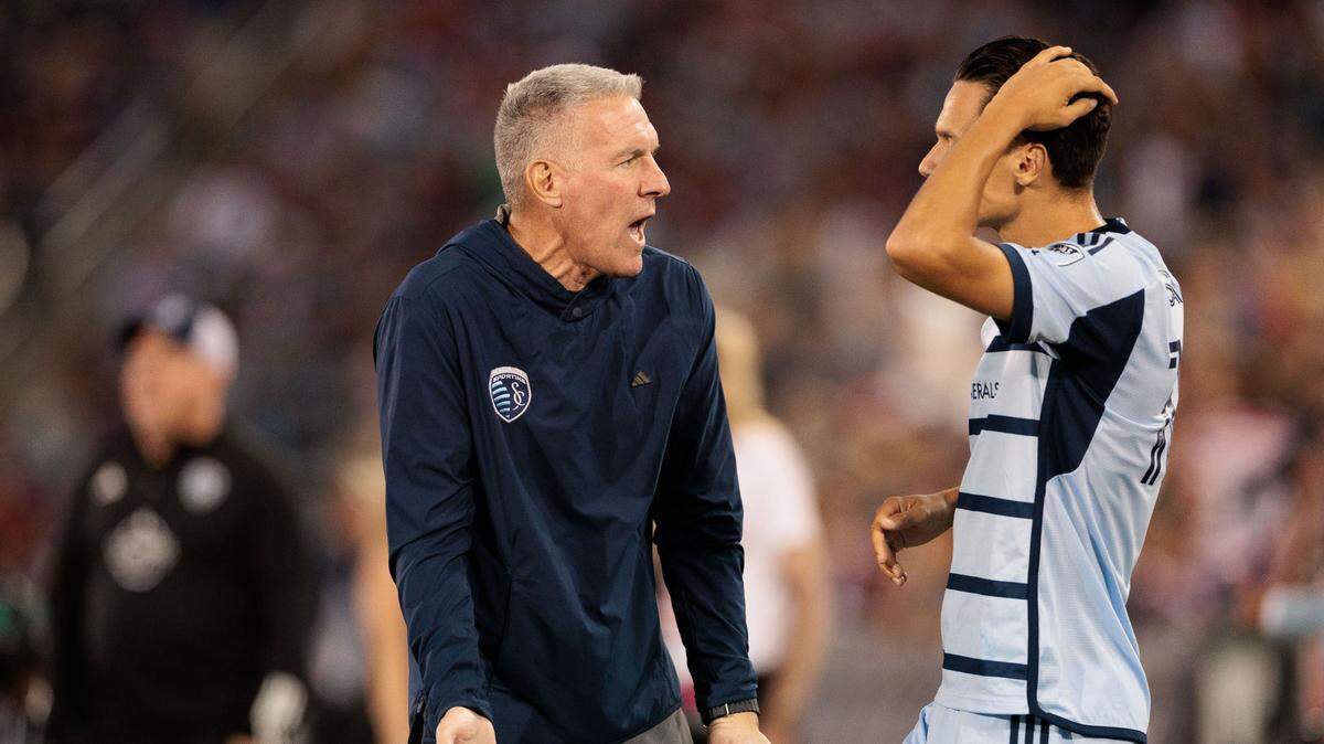 Sporting Kansas City coach Peter Vermes talks with forward Daniel Salloi (10) during the second half against the Colorado Rapids at Dick’s Sporting Goods Park in Commerce City, Colorado, on July 4, 2024.