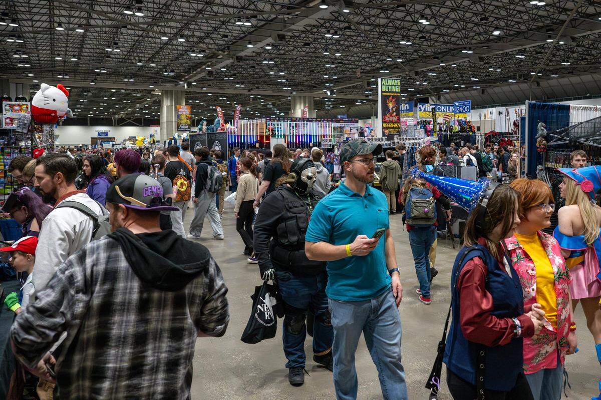 Visitors attend Planet Comicon at the Kansas City Convention Center on Friday, March 21, 2025.