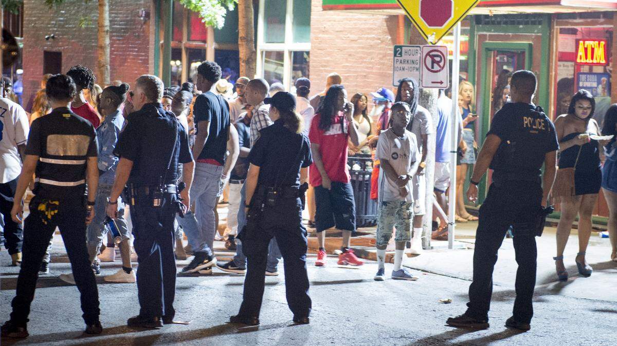 File photo. Westport Public Safety officers and Kansas City Police officers formed a line to watch the crowd as Kansas City officers escorted a woman from the bar district during what Kansas City police described as a typical Saturday night on Sunday, July 30, 2017, in Kansas City, Missouri.