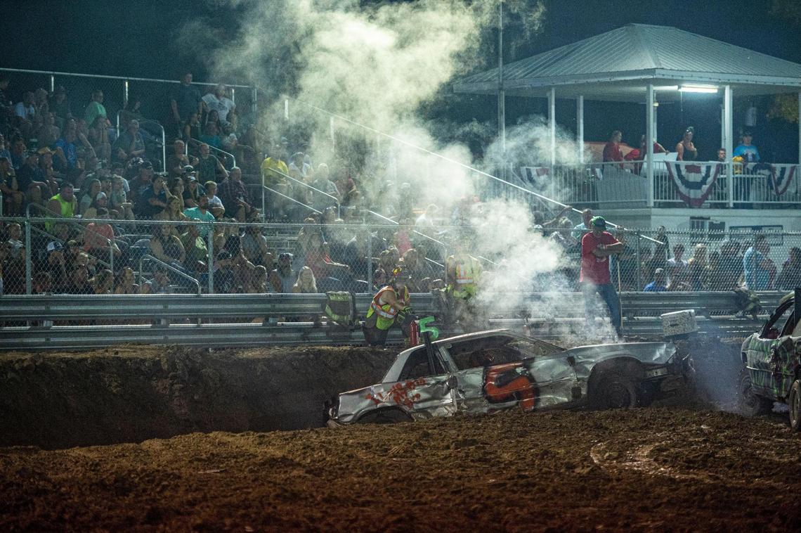 Brandon Vossmar gets pushed into the ditch by other cars at the demolition derby at the Platte County Fair, Thursday, July 22, 2021, in Tracy, Missouri.