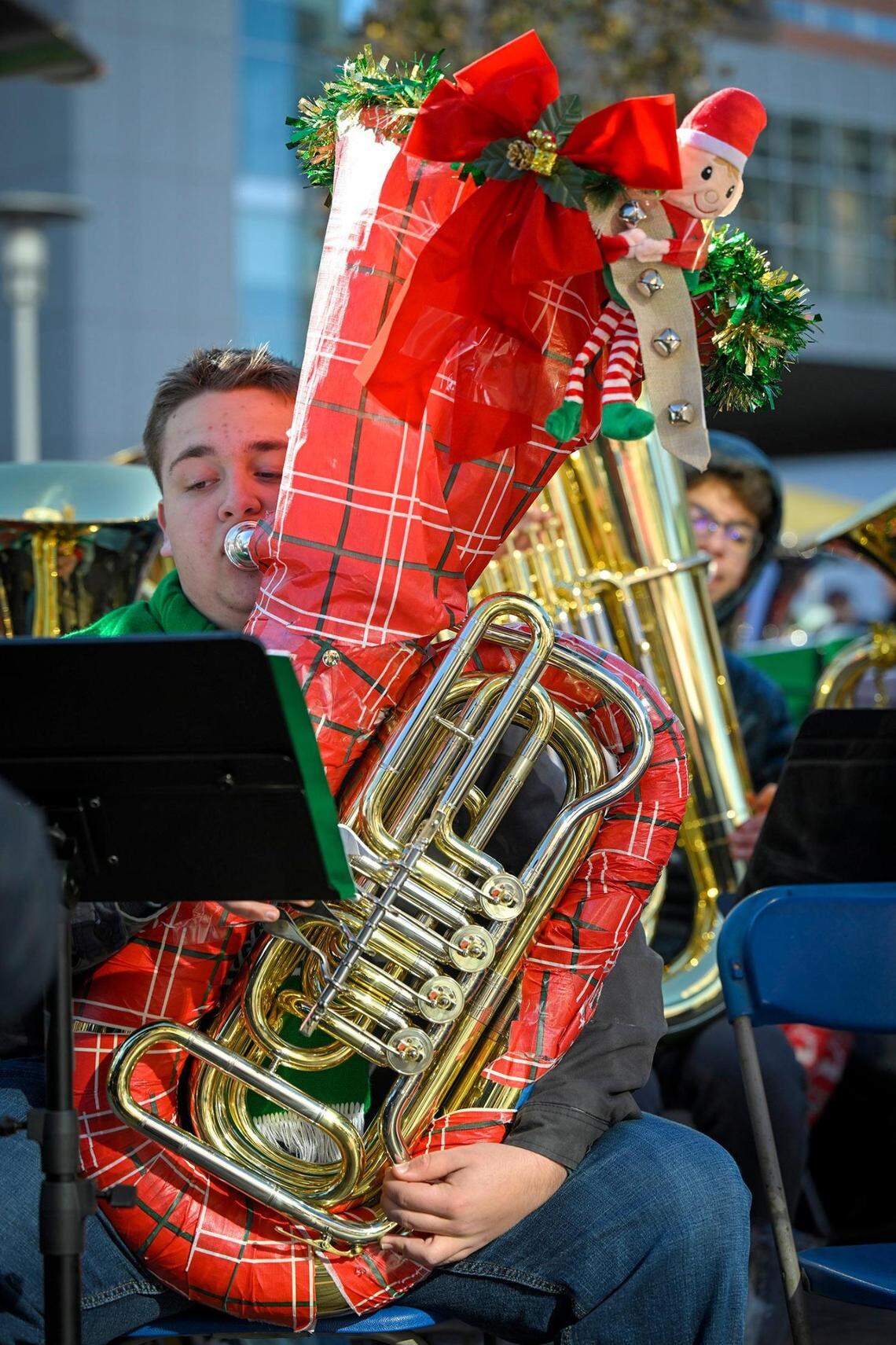 With his tuba wrapped in Christmas paper, Matthew Bryan, 16, a sophomore at Gardner-Edgerton High School, joined hundreds of local tuba and euphonium players who gathered Tuesday for the annual KC Symphony TubaChristmas holiday concert.