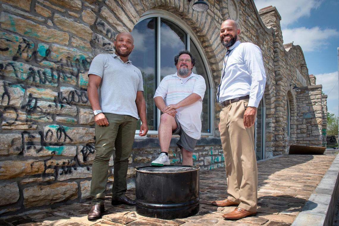 Business partners Shomari Benton, from left, Tim Duggan and Jason Parson outside the historic public works building they purchased and rehabbed at 2000 Vine St. in the historic 18th & Vine District. The 140-year-old building that once housed Kansas City water and street departments has been transformed into a mixed-use office and retail space and business incubators. The first Black-owned brewery, Vine Street Brewing, has committed to leasing space in the project’s south building.