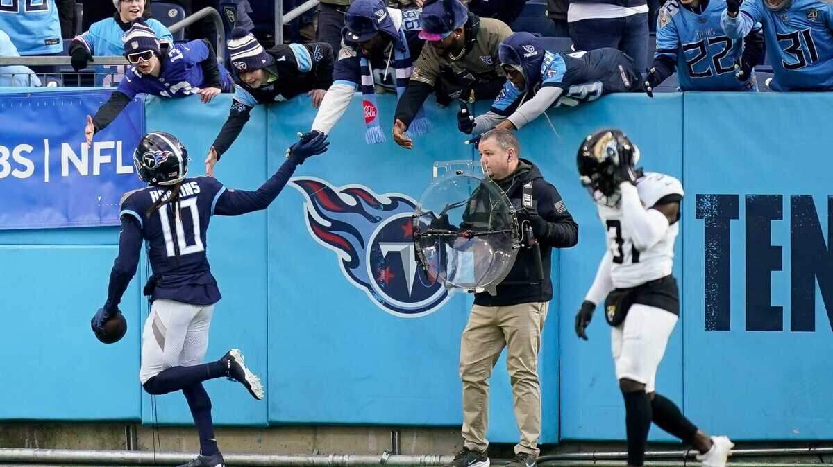 Tennessee Titans wide receiver DeAndre Hopkins (10) celebrates his touchdown against the Jacksonville Jaguars during the third quarter at Nissan Stadium in Nashville, Tenn., Sunday, Jan. 7, 2024.