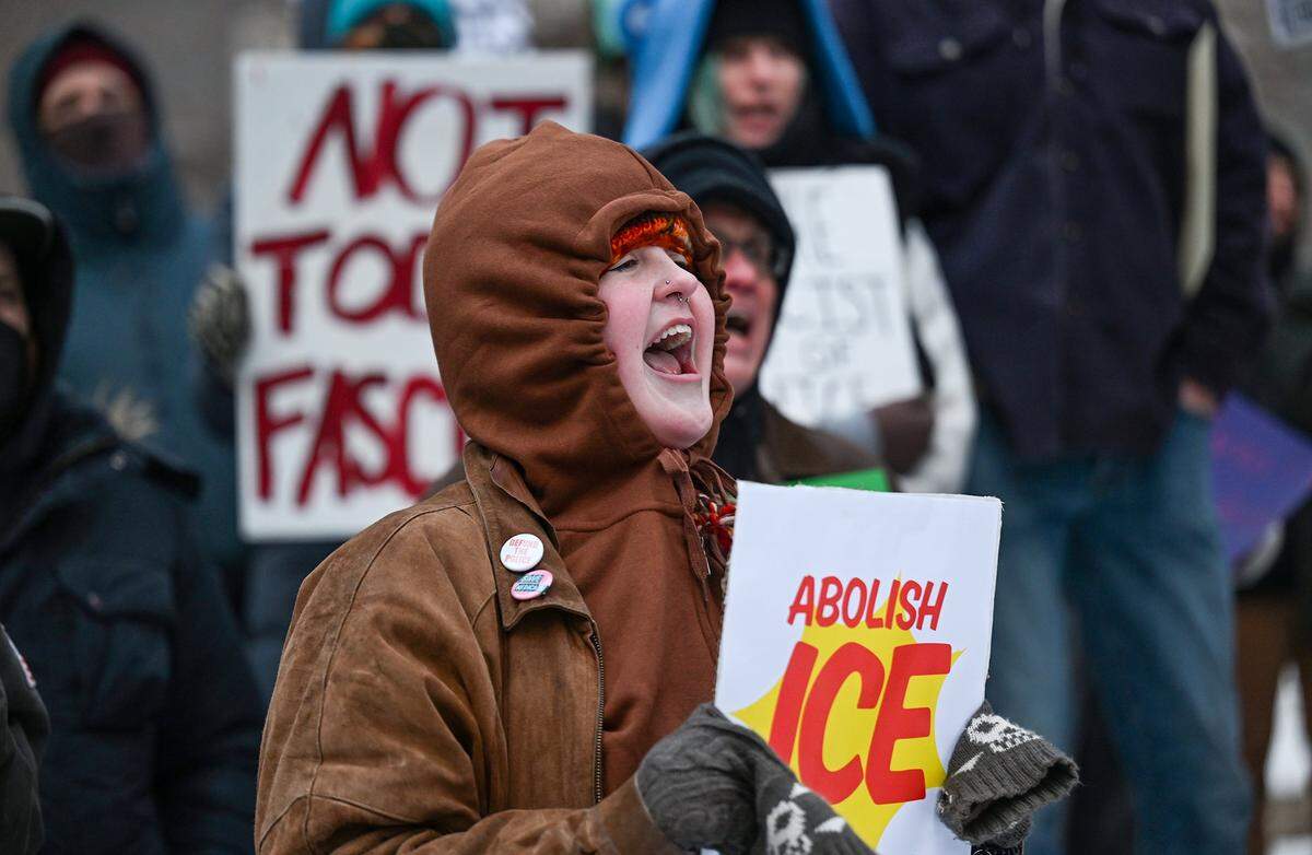 Protesters joined nationwide demonstrations against ICE in downtown Kansas City in freezing temperatures on Friday, Jan. 30, 2026.