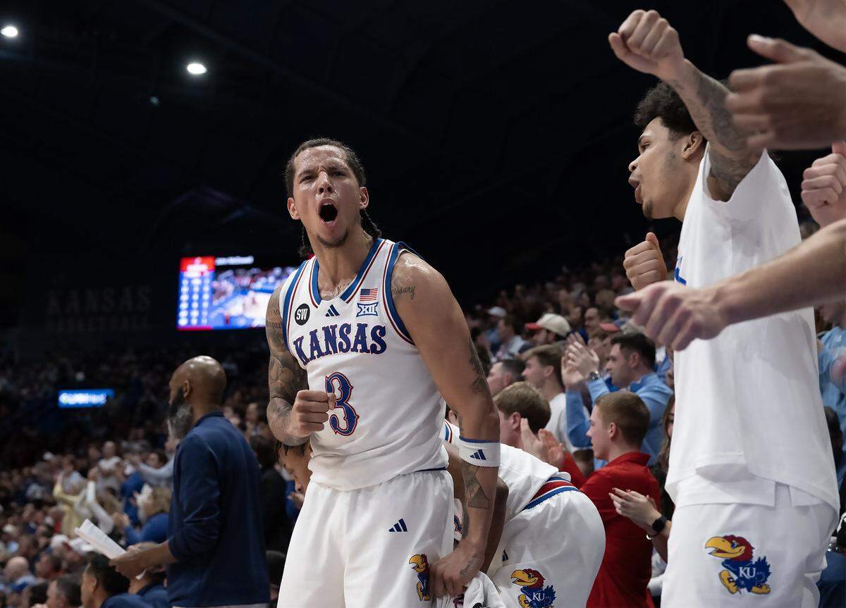 Kansas Jayhawks guard Tre White (3) and the KU bench were pumped up in the second half against the Iowa State Cyclones on Tuesday, Jan. 13, 2026, at Allen Fieldhouse in Lawrence.