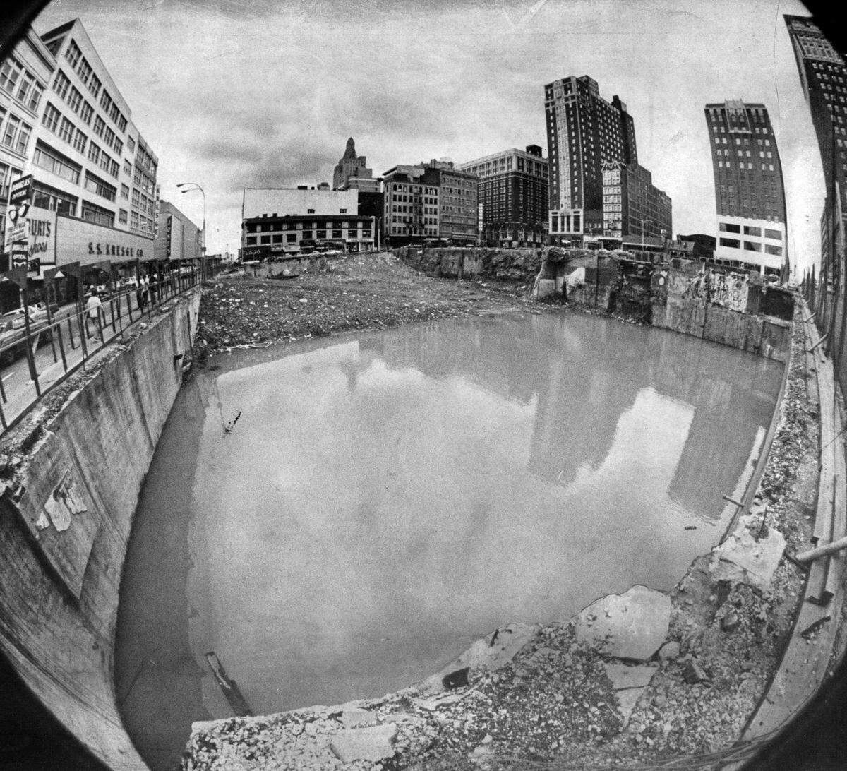 Kansas City had a lake of greenish, stagnant water in the middle of its downtown. after heavy rains flooded the area where City Center Square was being constructed.