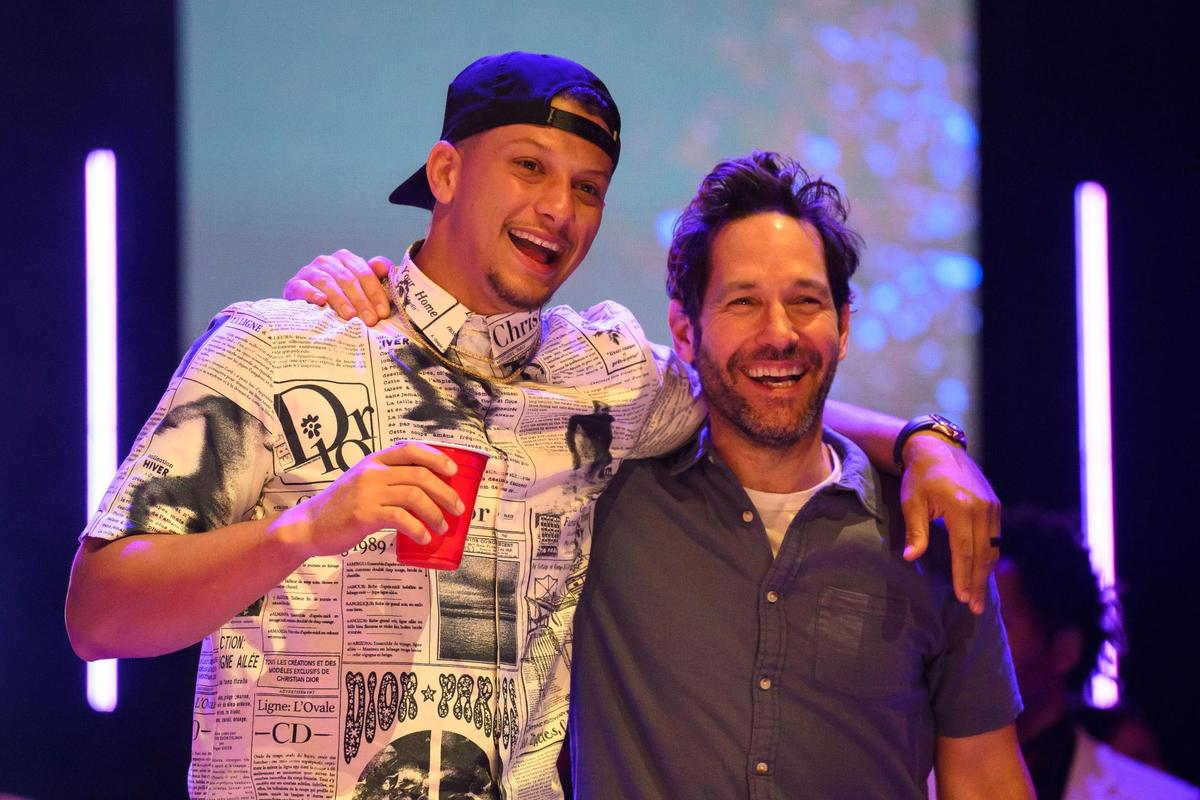Kansas City Chiefs quarterback Patrick Mahomes, left, and host Paul Rudd enjoy the action during the Big Slick auction Saturday at the T-Mobile Center.