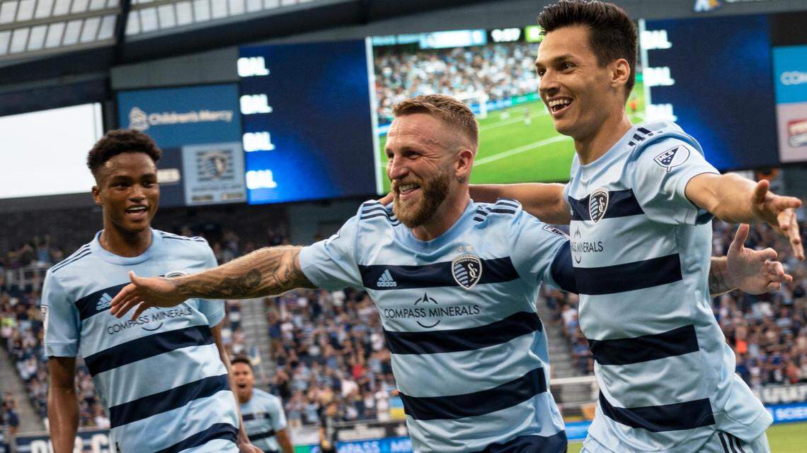 Sporting Kansas City forward Dániel Sallói celebrates with teammate Johnny Russell after scoring a goal in the first half the quarter finals of the U.S. Open Cup against Union Omaha on June 22, 2022, at Children’s Mercy Park in Kansas City, KS.