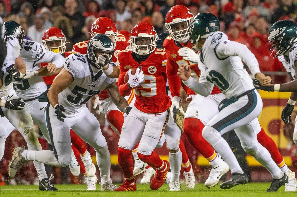 Kansas City Chiefs wide receiver Kadarius Toney (19) deflects a tackle by Philadelphia Eagles linebacker Ben VanSumeren (57) in the second quarter during an NFL football game against the Philadelphia Eagles at GEHA Field at Arrowhead Stadium on Monday, Nov. 20, 2023, in Kansas City.