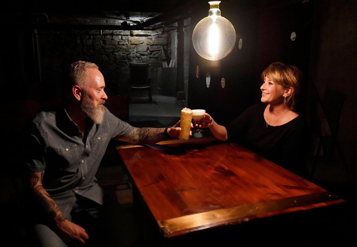 Smith and Hamilton in the building’s basement, where they say they may eventually open a speakeasy.