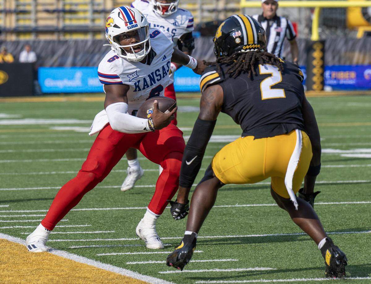 Kansas Jayhawks quarterback Jalon Daniels (6) steps out of bounds in the third quarter during a game against the Missouri Tigers at Faurot Field at Memorial Stadium on Saturday, Sept. 6, 2025, in Columbia.