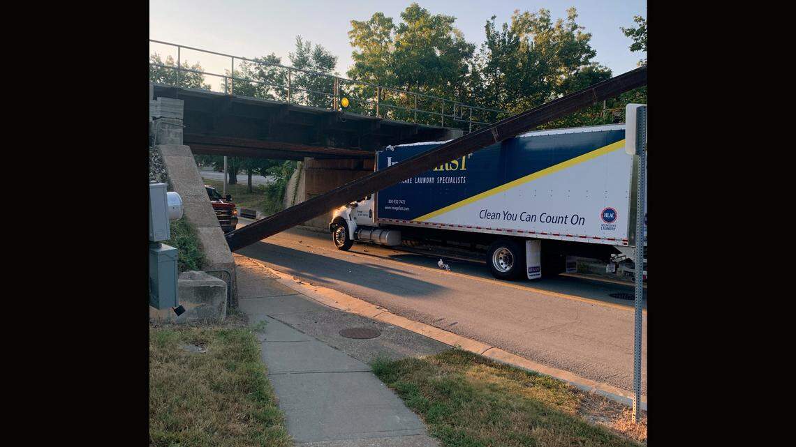 Police have shut down a part of West Spruce Street in Olathe near the Johnson County Courthouse after another truck crashed into a low clearance railroad bridge on the city’s west side Thursday morning.