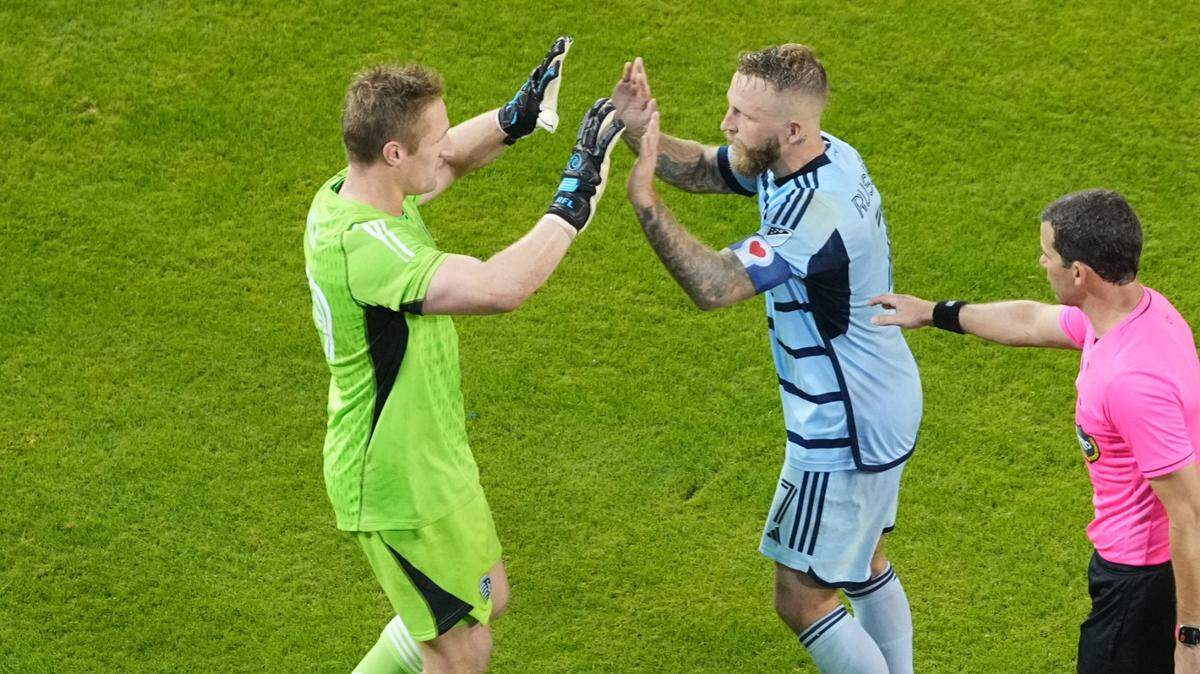 Sporting Kansas City goalkeeper Tim Melia, left, forward Johnny Russell and their teammates are moving on the MLS playoffs after dispatching the San Jose Earthquakes via penalty kicks in Wednesday night’s MLS Western Conference Wild-Card Match at Children’s Mercy Park.