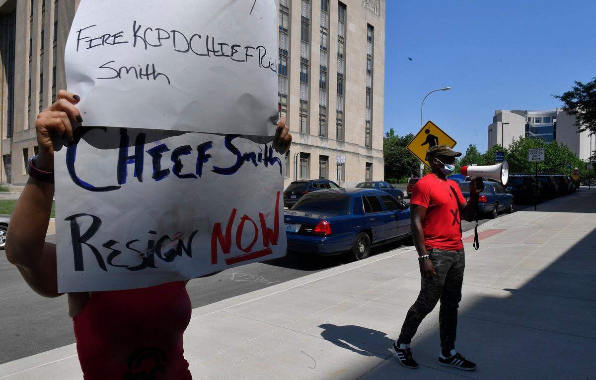 Steve Young, right, led about a dozen protesters outside a Board of Police Commissioners meeting calling for former KCPD Chief Rick Smith to step down. Young also has been organizing weekly protests outside the police department since June 2020, shortly after George Floyd’s murder. In fall 2021, Young launched the KC Law Enforcement Accountability Project.