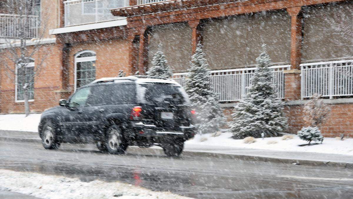 Snow fell Wednesday morning in Mission as a winter storm moved into the Kansas City area. An Arctic blast will send temperatures plummeting and wind chills will plunge below zero Thursday morning.