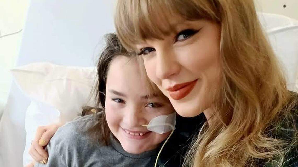 Taylor Swift made a surprise visit to Children’s Mercy in Kansas City on Thursday, where she met with staff and patients including 11-year-old Baylee Nuzum of Butler, Mo., seen here with the superstar.
