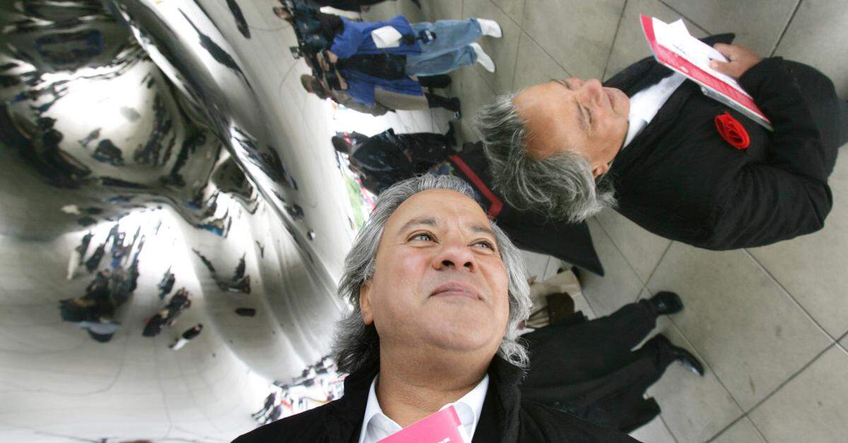 Sculptor Anish Kapoor is reflected on the ceiling of his sculpture "Cloud Gate" after the official dedication ceremony in Chicago's Millennium Park on May 15, 2006.