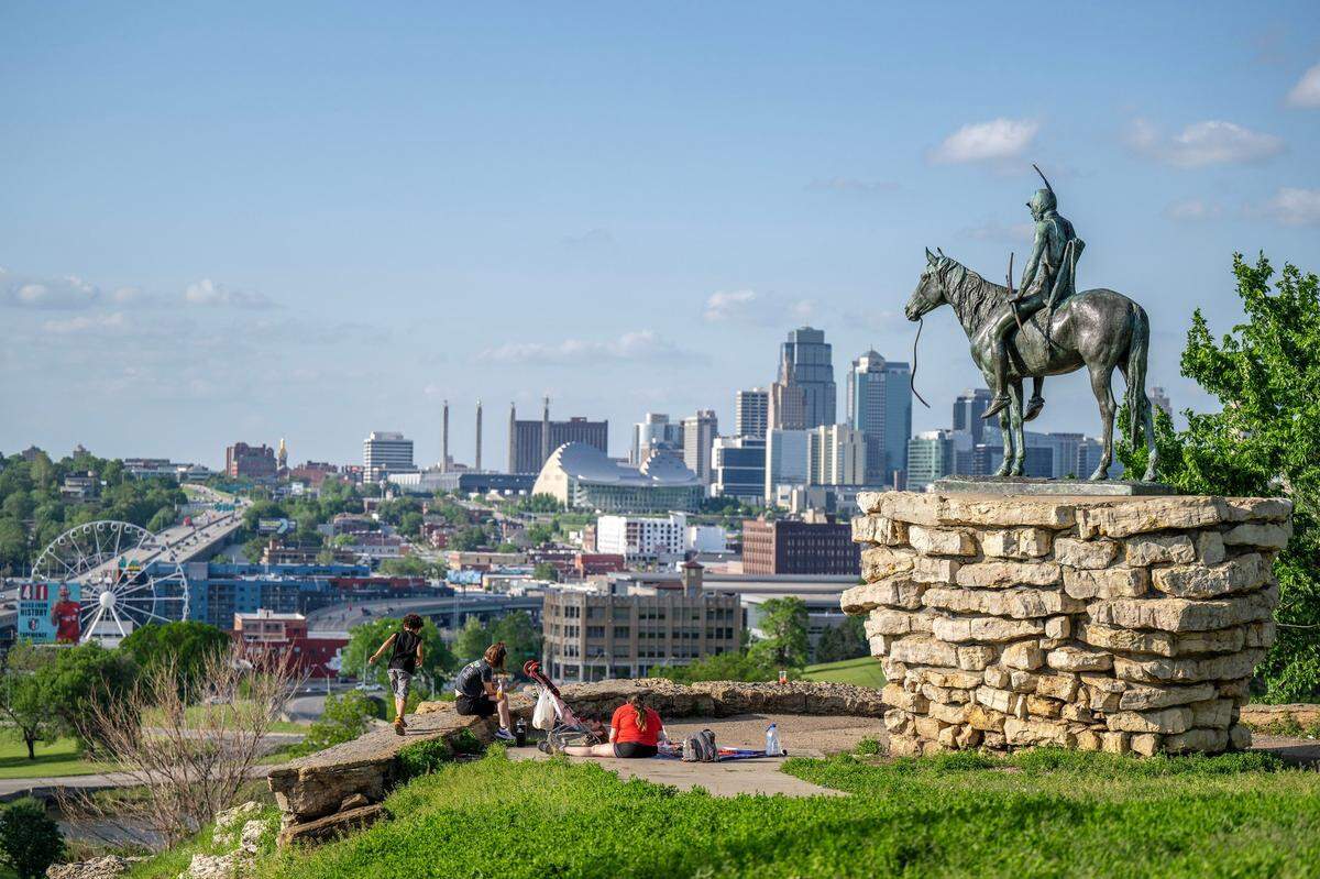 The Scout statue, created by artist Cyrus E. Dallin, looks out over downtown from Penn Valley Park.