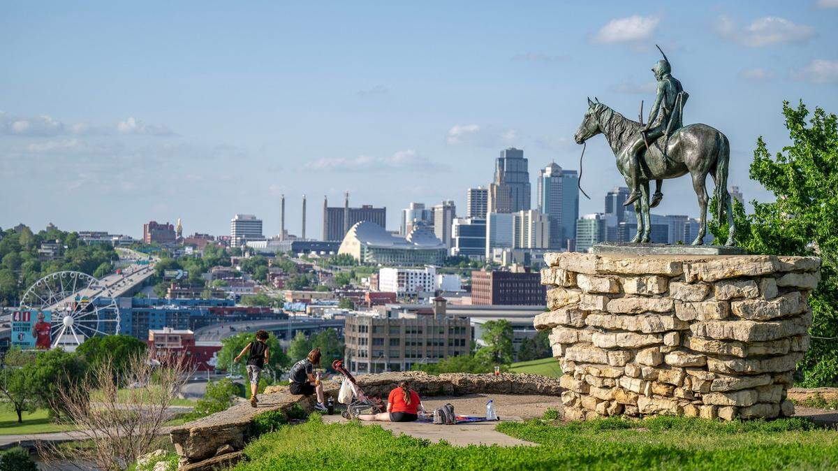 The Scout statue, created by artist Cyrus E. Dallin, looks out over downtown from Penn Valley Park.