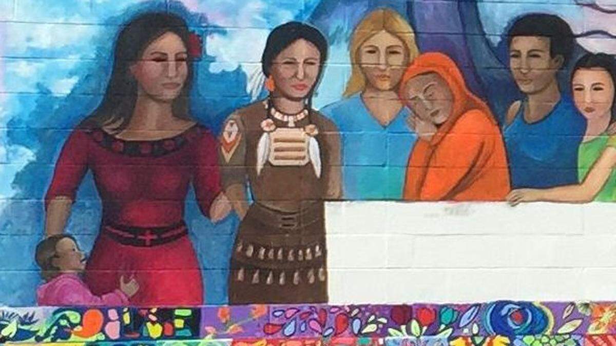 Kansas City artist bj McBride says she added this image of an immigrant child to a Topeka mural "intuitively and spontaneously." It has since been painted over.