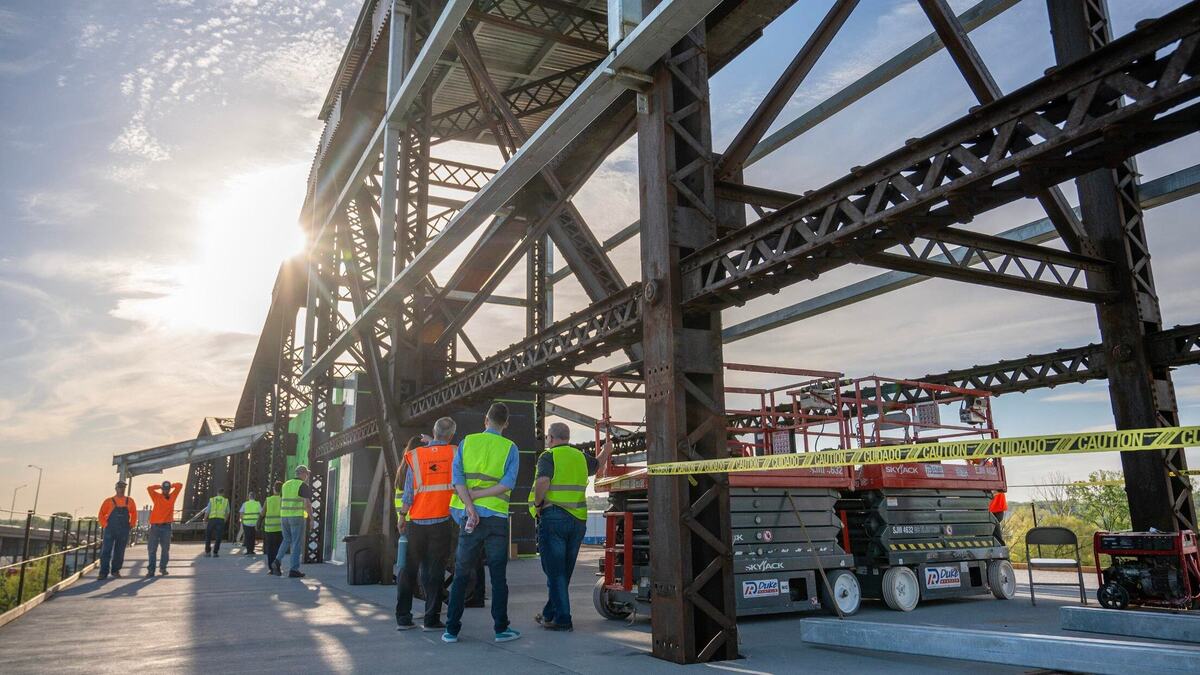 Guests explore Rock Island Bridge and its new construction additions during a tour on Wednesday, April 17, 2024, in Kansas City, Kansas.