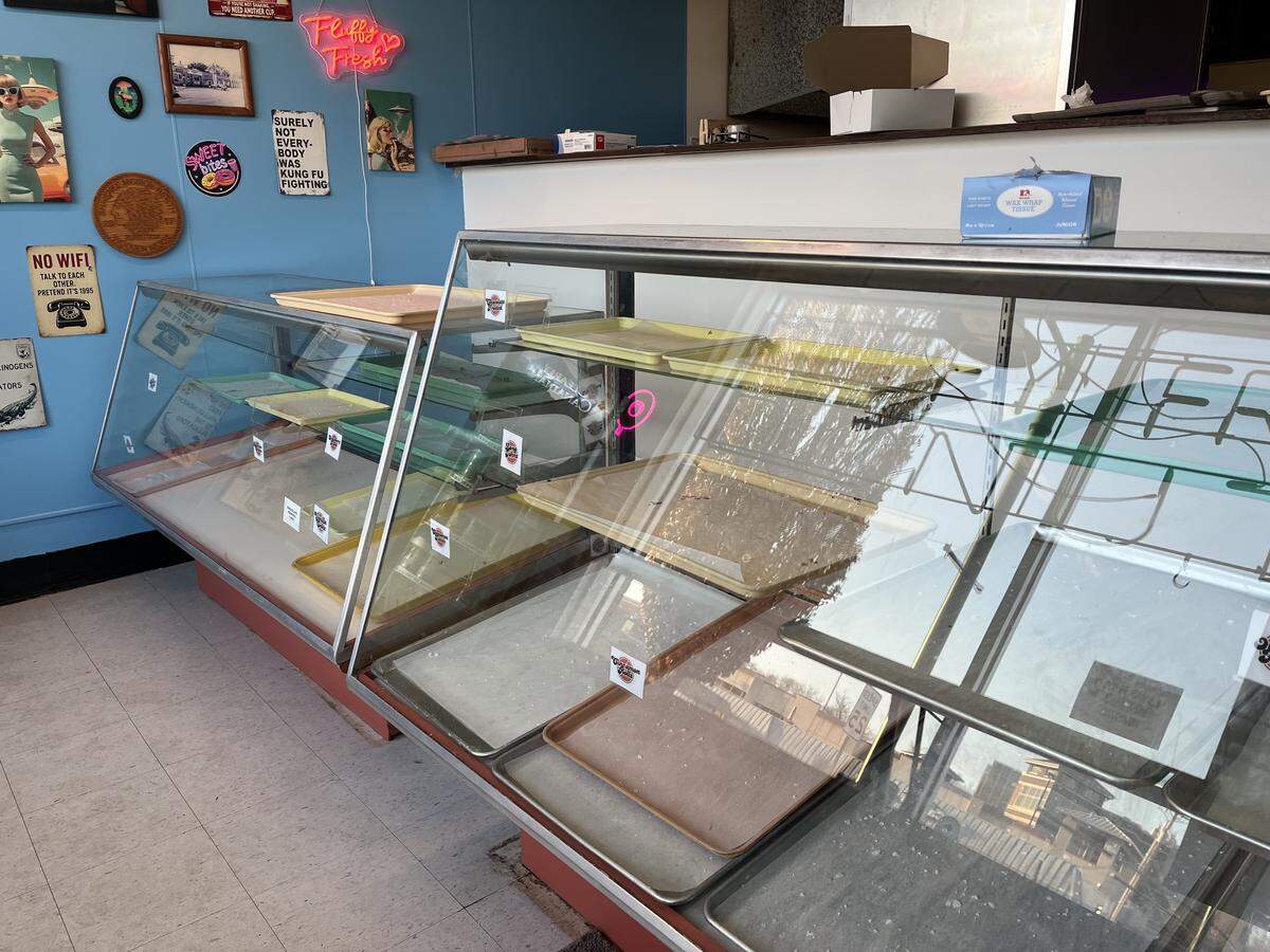 The donut cases inside Fluffy Fresh donuts in Mission, KS, were empty by 7:30 a.m. Thursday morning, its opening day.