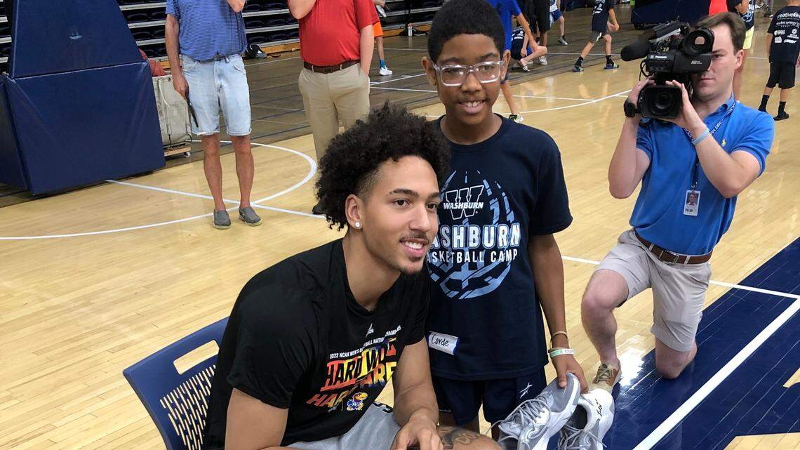 Kansas fourth-year junior forward Jalen Wilson posed for a picture with a basketball camper on Tuesday at Washburn University’s Lee Arena (June 28, 2022).