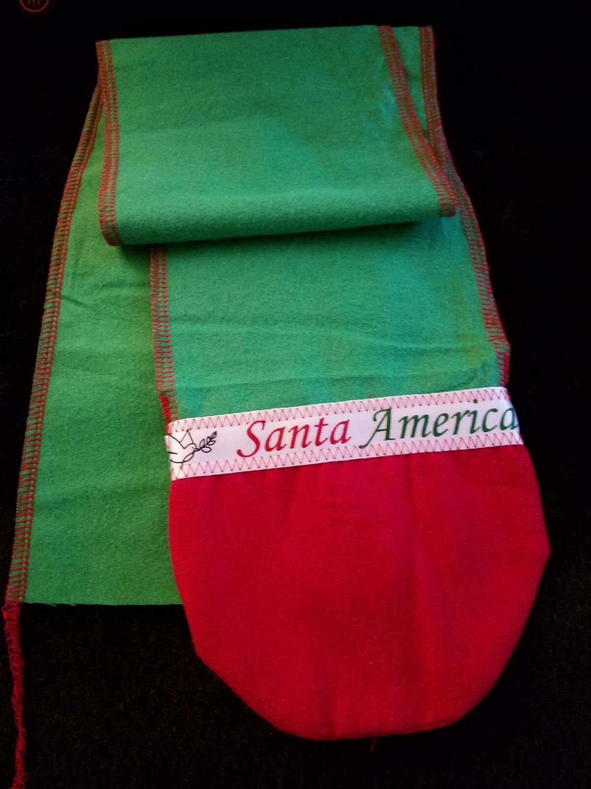 Santa America Santas will often leave the children they see with a Santa “hug,” a fabric scarf that ends in mittens, that they can wear anytime they feel like they need a hug from Santa. Tresa Boydston of Platte City makes them for the members.