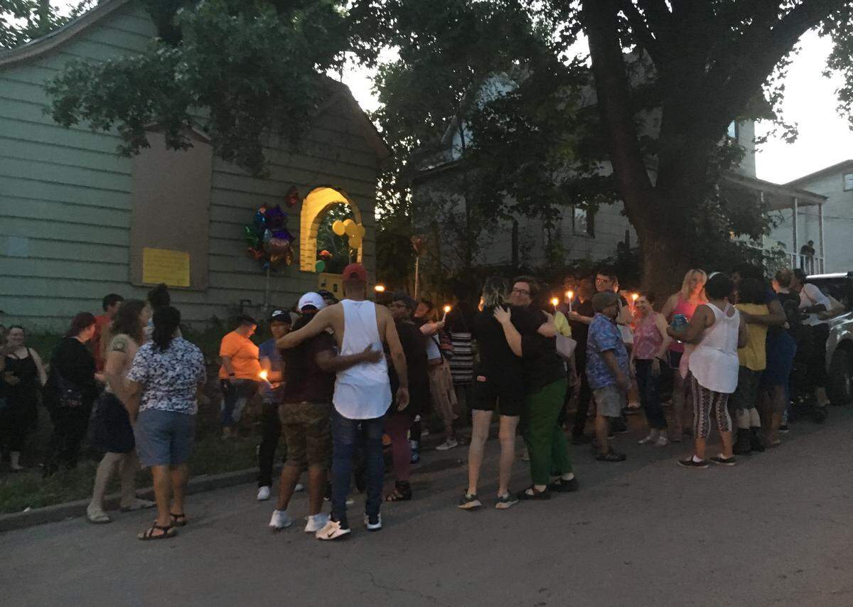Friends exchanged hugs Saturday, June 29, 2019, during a candlelight vigil held for Brooklyn Lindsey, a 32-year-old transgender woman who was found dead outside a home on Spruce Avenue in Kansas City.