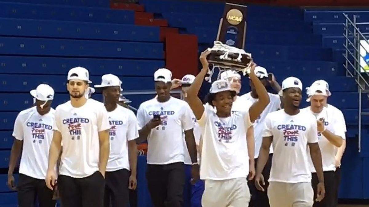 Fans flocked to Allen Fieldhouse on Sunday night to greet the Jayhawks (above) after they returned from their Elite Eight win over Duke. On Saturday, the fieldhouse will be open for fans to watch KU's Final Four game against Villanova on the video board.