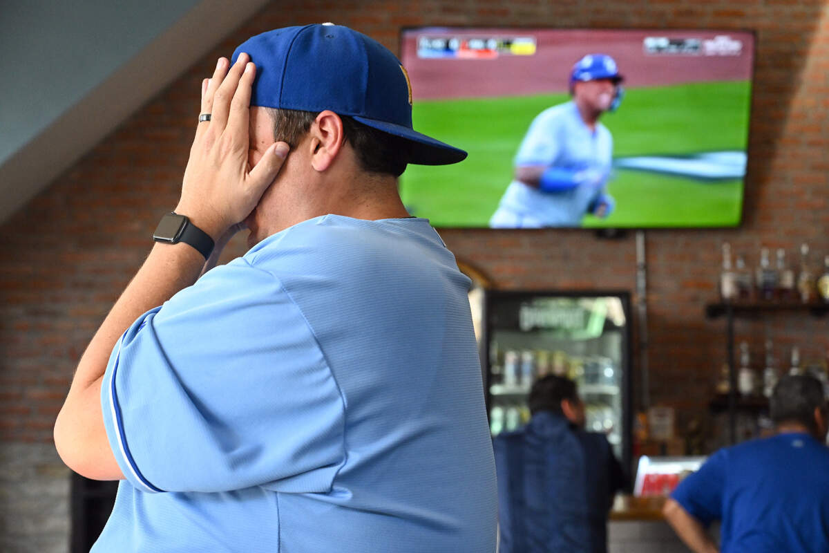 Josh Keiser, Kansas City, reacts after Kansas City Royals catcher Salvador Perez was called out on a play during the AL Wild Card game against the Baltimore Orioles on Tuesday, Oct. 1, 2024. Keiser was watching the game at The Davenport, a sports bar in Kansas City, Kansas.