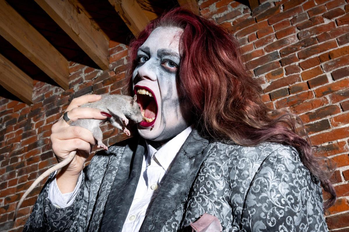 Rat Brat horrifies visitors at the Edge of Hell with her appetite for live rats. The rats are not harmed during the performance.