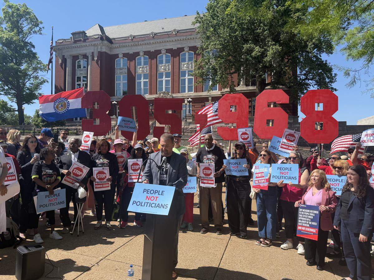 Richard Von Glahn, the director of a referendum campaign to strike down Missouri’s congressional map, speaks outside of the Missouri Supreme Court on May 12, 2026. Opponents of gerrymandering held up signs signifying how many signatures they had collected.