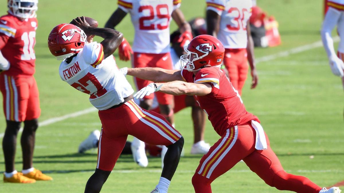 Cornerback Rashad Fenton (27) intercepts a pass intended for wide receiver Dalton Schoen during Kansas City Chiefs training camp at Missouri Western State University in St. Joseph Tuesday, Aug. 17, 2021.