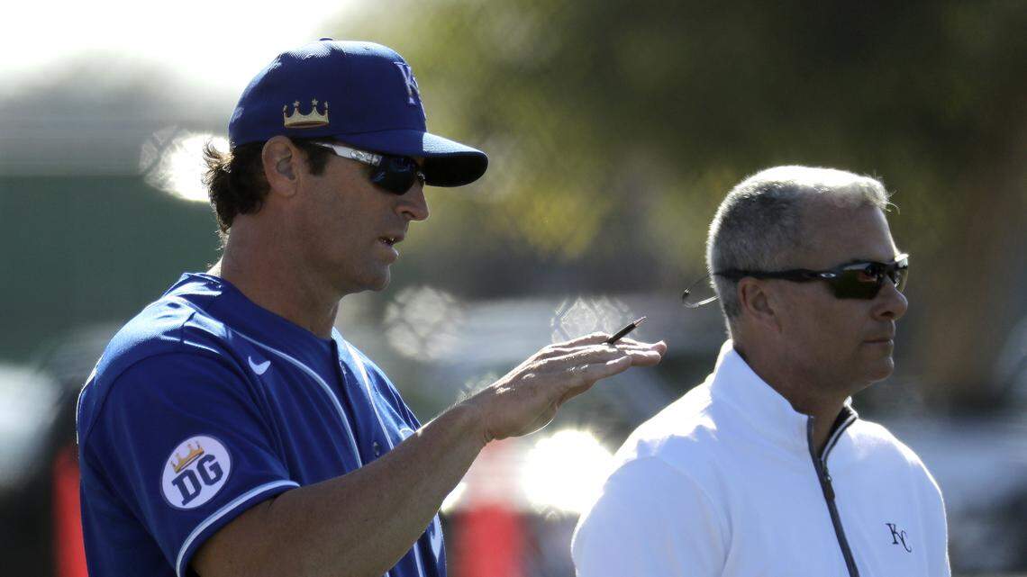 Royals manager Mike Matheny, left, talks with KC general manager Dayton Moore during spring training in Surprise, Ariz.